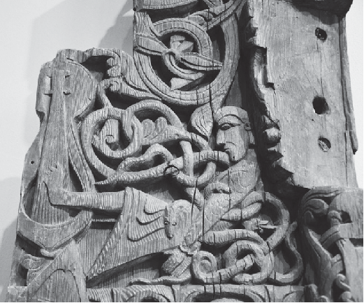Gunnar plays the harp in the snake pit, depicted on the Hylestad Portal, Norway