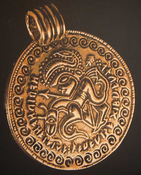 Bracteate showing Odin with a stacked Tiwaz rune symbol to the top right of his head, Denmark, c. 500 CE