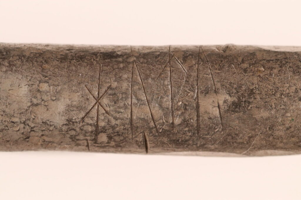 Silver ingot with runes reading "hutu," Rebild Hoard, Denmark, 10th century